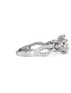 Side profile view of a white gold 2 carat round lab grown diamond ring with an intertwined pave band.