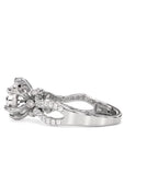Side view showing the openwork twisted pave band and 6-prong basket of a round lab diamond ring.