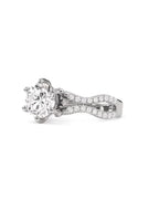 Side top-down view of a round lab grown diamond ring on a white gold twisted pave band.