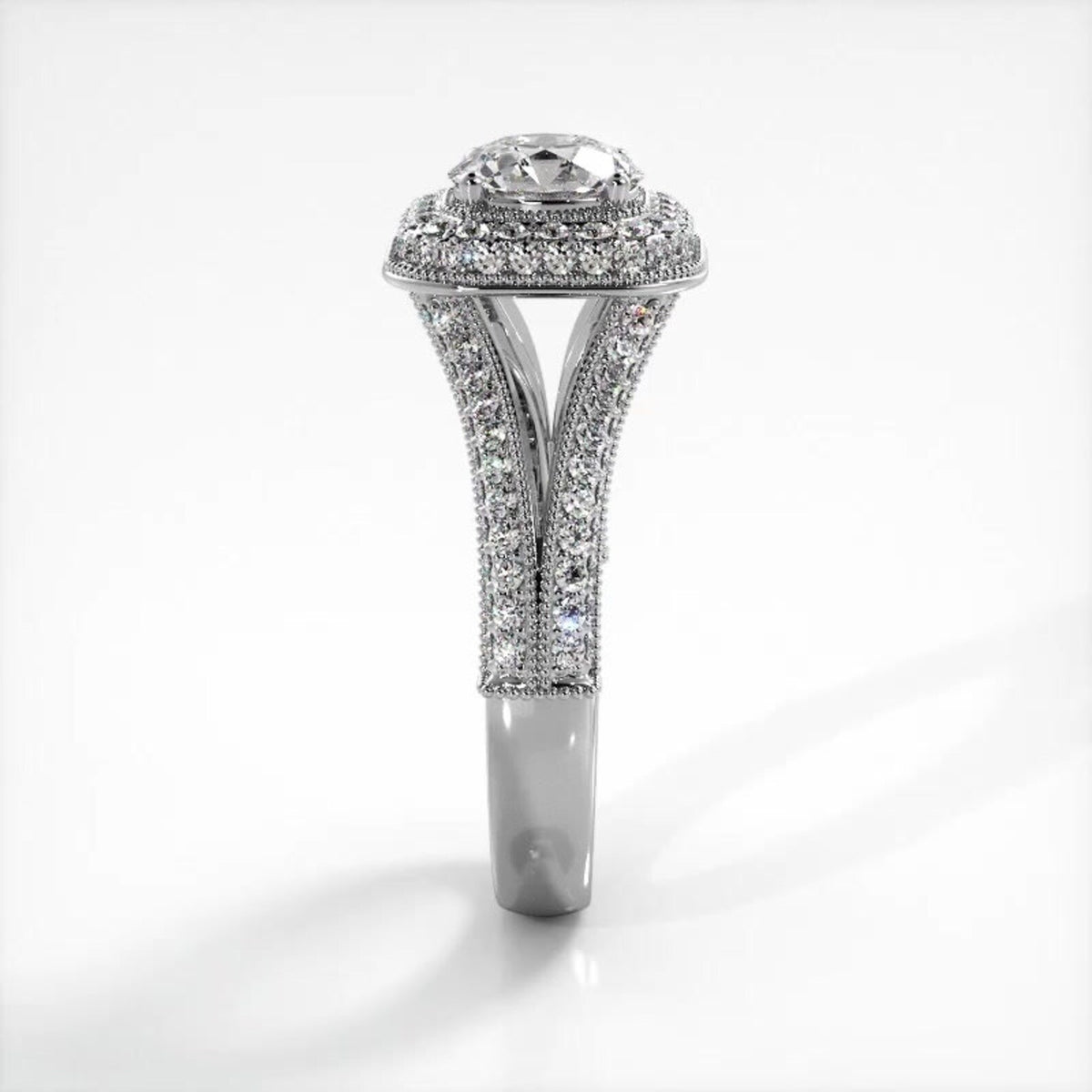Side elevation view of white gold 2 carat round lab diamond ring with elevated cushion halo and pave shank.