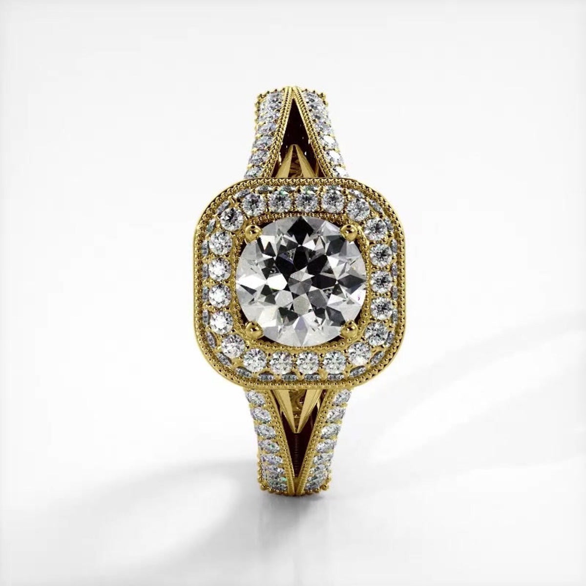 Vertical front view of 14K yellow gold 2 carat round lab diamond ring with cushion halo and pave split shank.