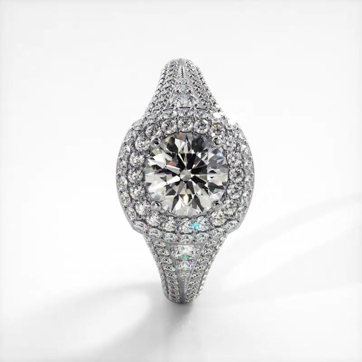 Vertical top view of a white gold 2 CT round lab created diamond double cushion halo ring with wide pave shank.