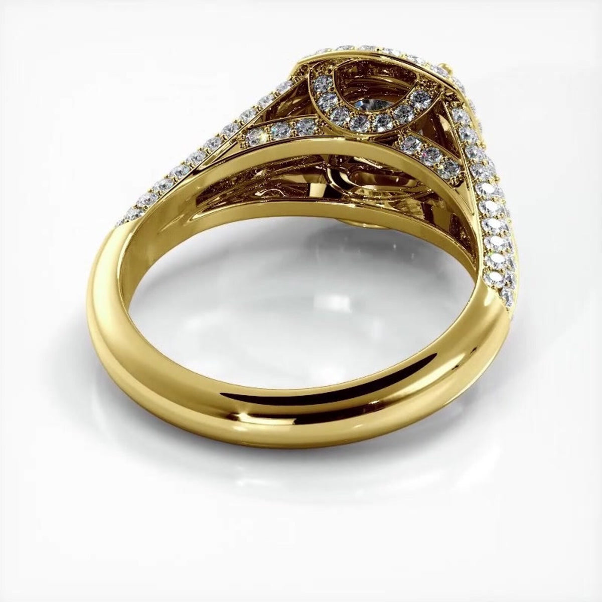 Bottom undergallery view of a yellow gold 2 carat round lab diamond ring showing inner pave bridge arches.
