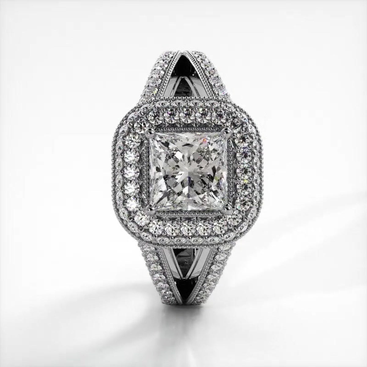 Direct top-down view of a 2 CT princess cut lab grown diamond ring with double halo setting in white gold.