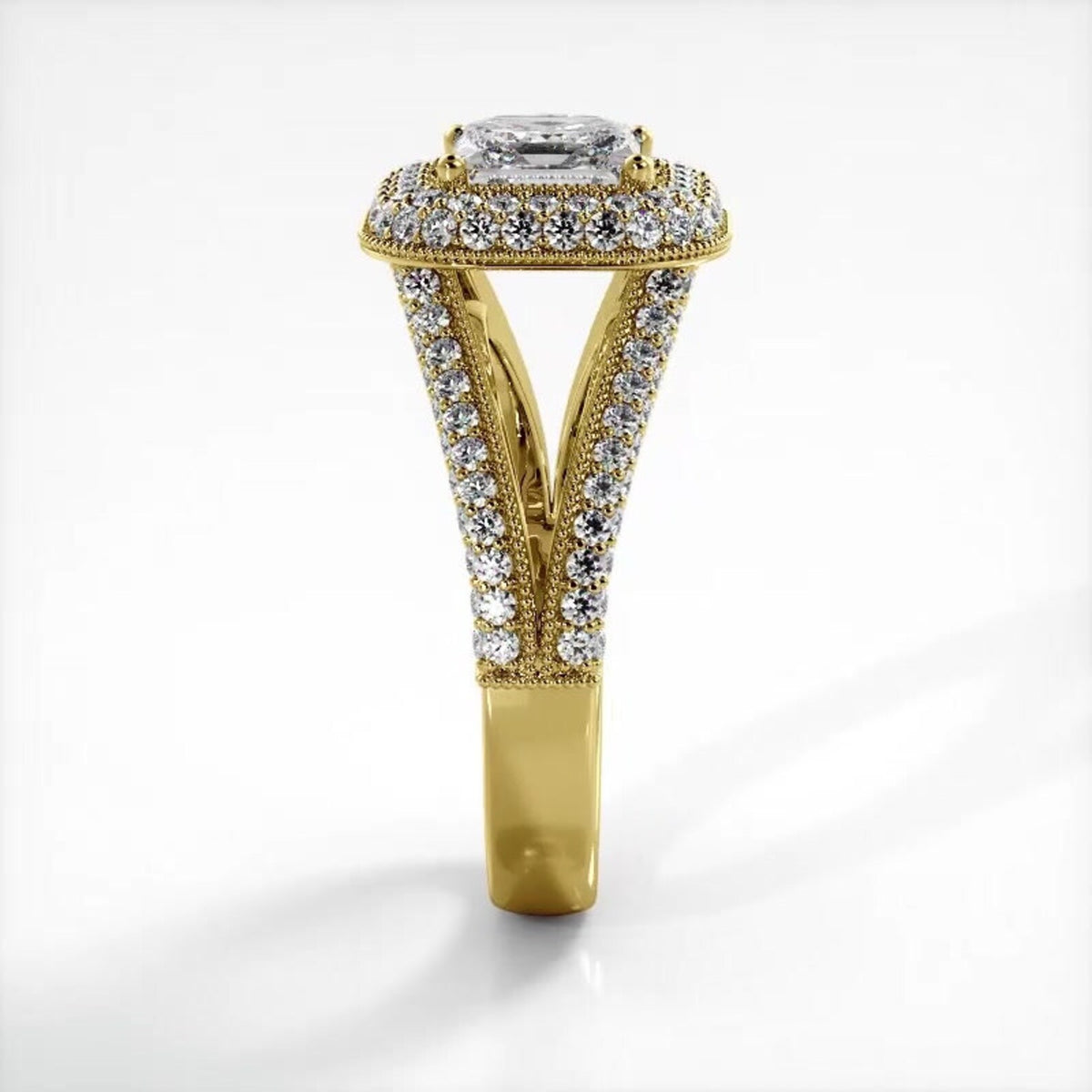 Side elevation perspective of a 2 carat princess cut lab diamond ring in yellow gold highlighting the cathedral split shank.