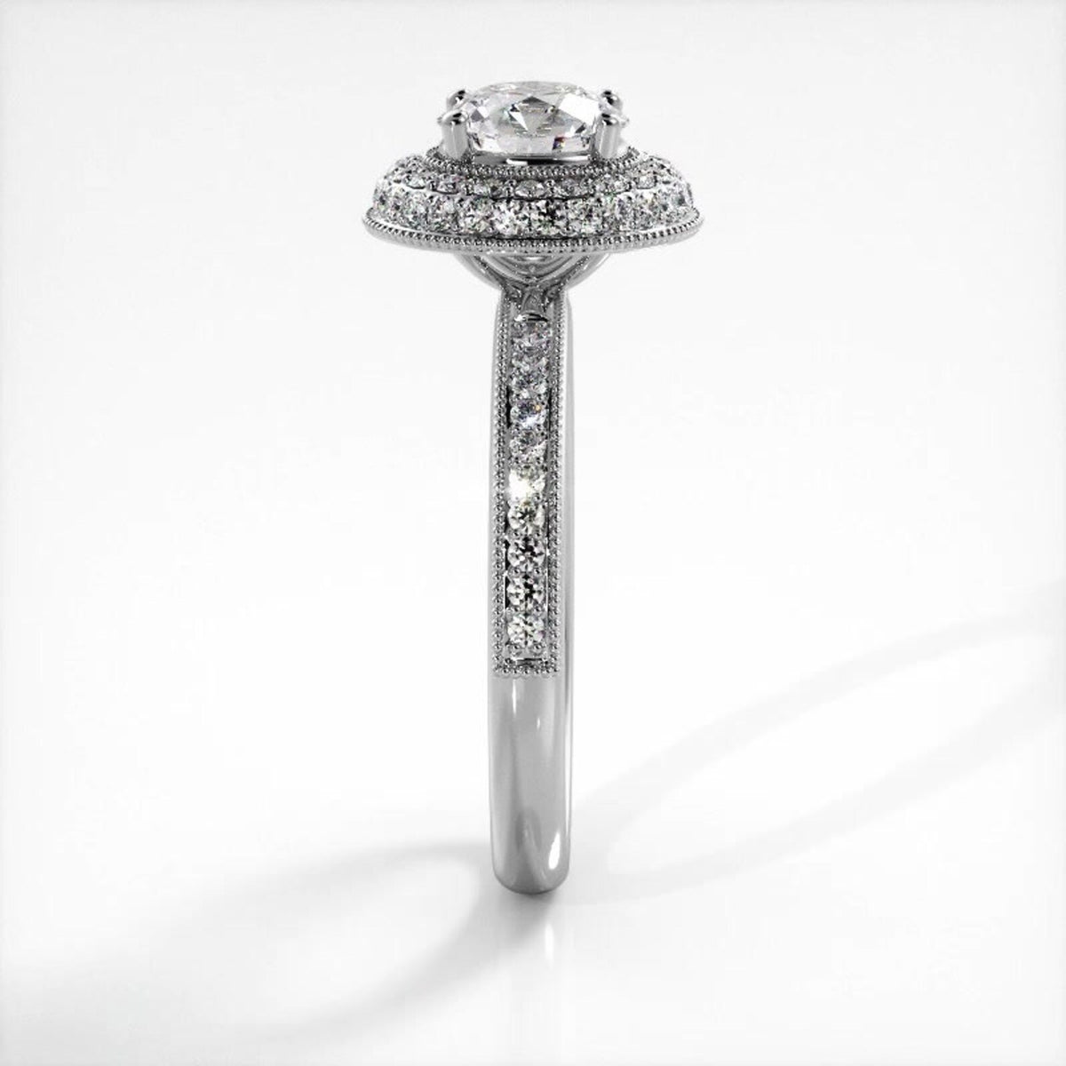Side profile view of a white gold 2 CT round lab diamond ring showing milgrain pave band and double halo setting.