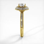 Side profile view of a yellow gold 2 CT round lab created diamond engagement ring with pave shank.