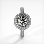 Vertical top view of a white gold 2 CT round lab diamond ring featuring double halo with pave band.