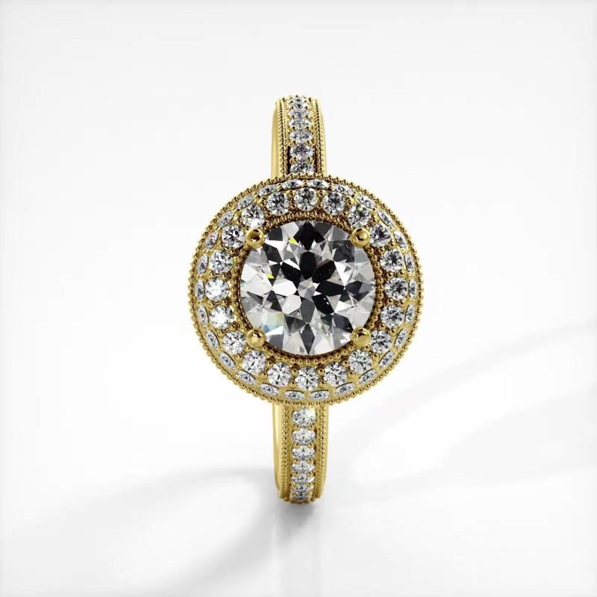 Vertical top view of a 14K yellow gold 2 CT round lab diamond engagement ring with milgrain pave band.
