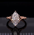 Front-facing view showing a 4 carat marquise cut lab grown diamond solitaire ring in rose gold with split cathedral shoulders.