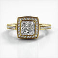 Top-down view of a 2 CT princess cut lab grown diamond engagement ring in yellow gold with cushion halo and milgrain pave band.