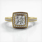 Top-down view of a 2 CT princess cut lab grown diamond engagement ring in yellow gold with cushion halo and milgrain pave band.