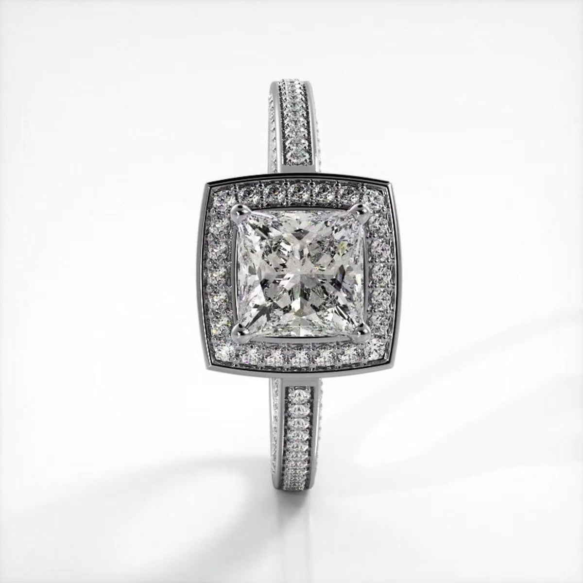 Vertical top-down view of a white gold 2 CT princess cut lab diamond ring featuring a cushion halo and milgrain band.