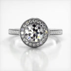 Top-down view of a 3 CT round cut lab grown diamond ring with round halo in white gold.