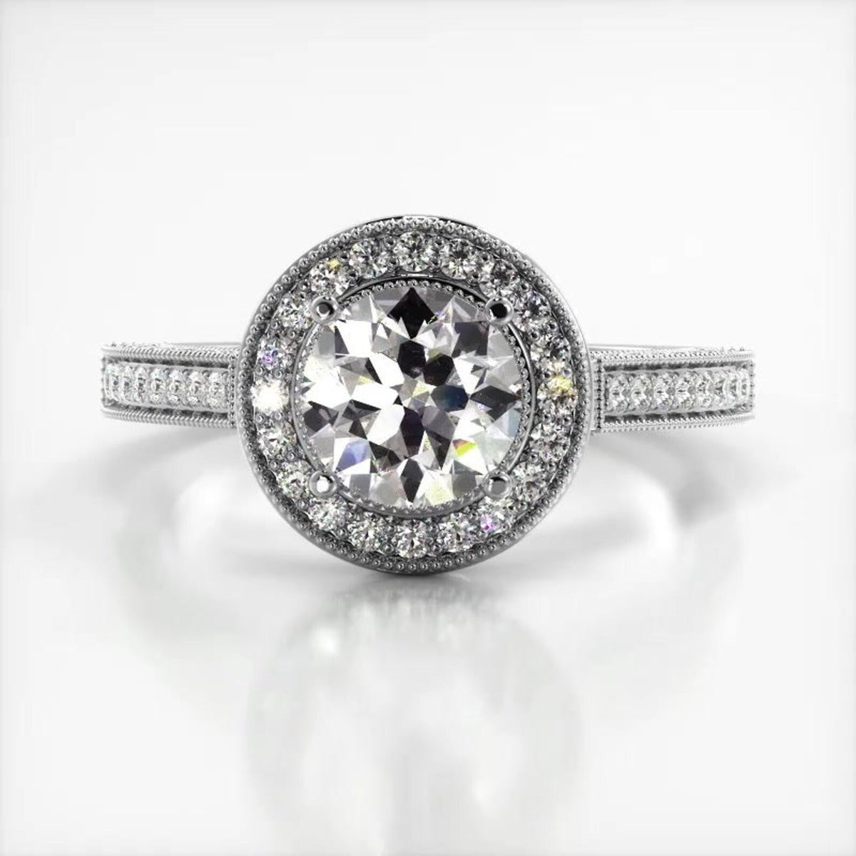 Top-down view of a 3 CT round cut lab grown diamond ring with round halo in white gold.