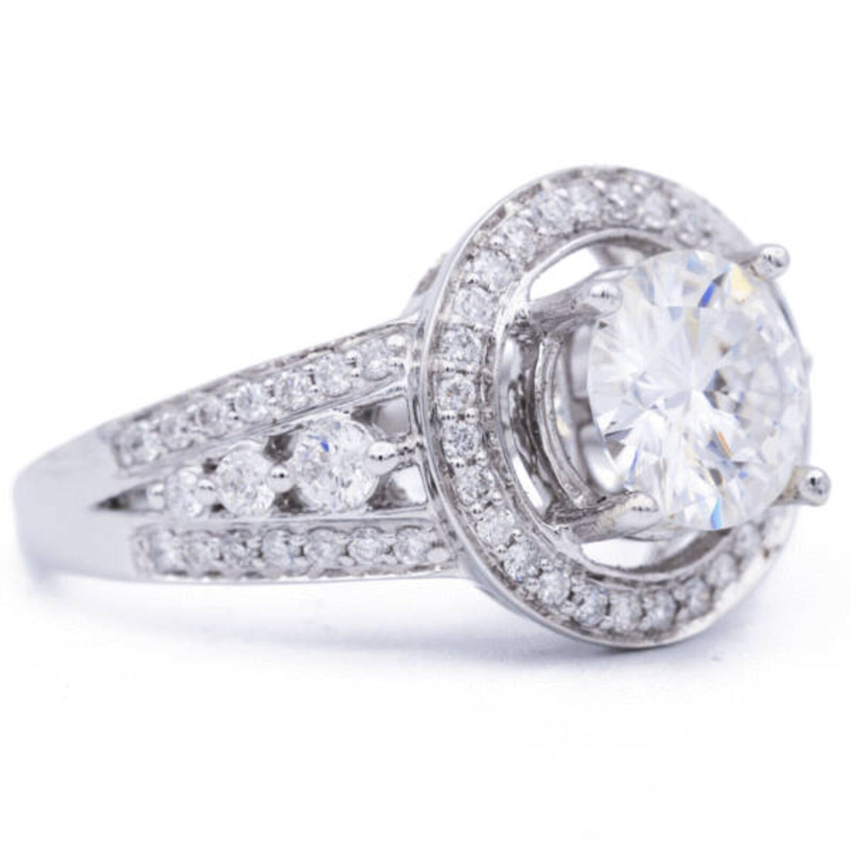 3 CT round lab grown diamond engagement ring side view showing split shank pave band and elevated halo setting