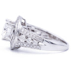 Profile view of 3 carat round lab diamond halo ring displaying prong setting and graduated side diamond accents