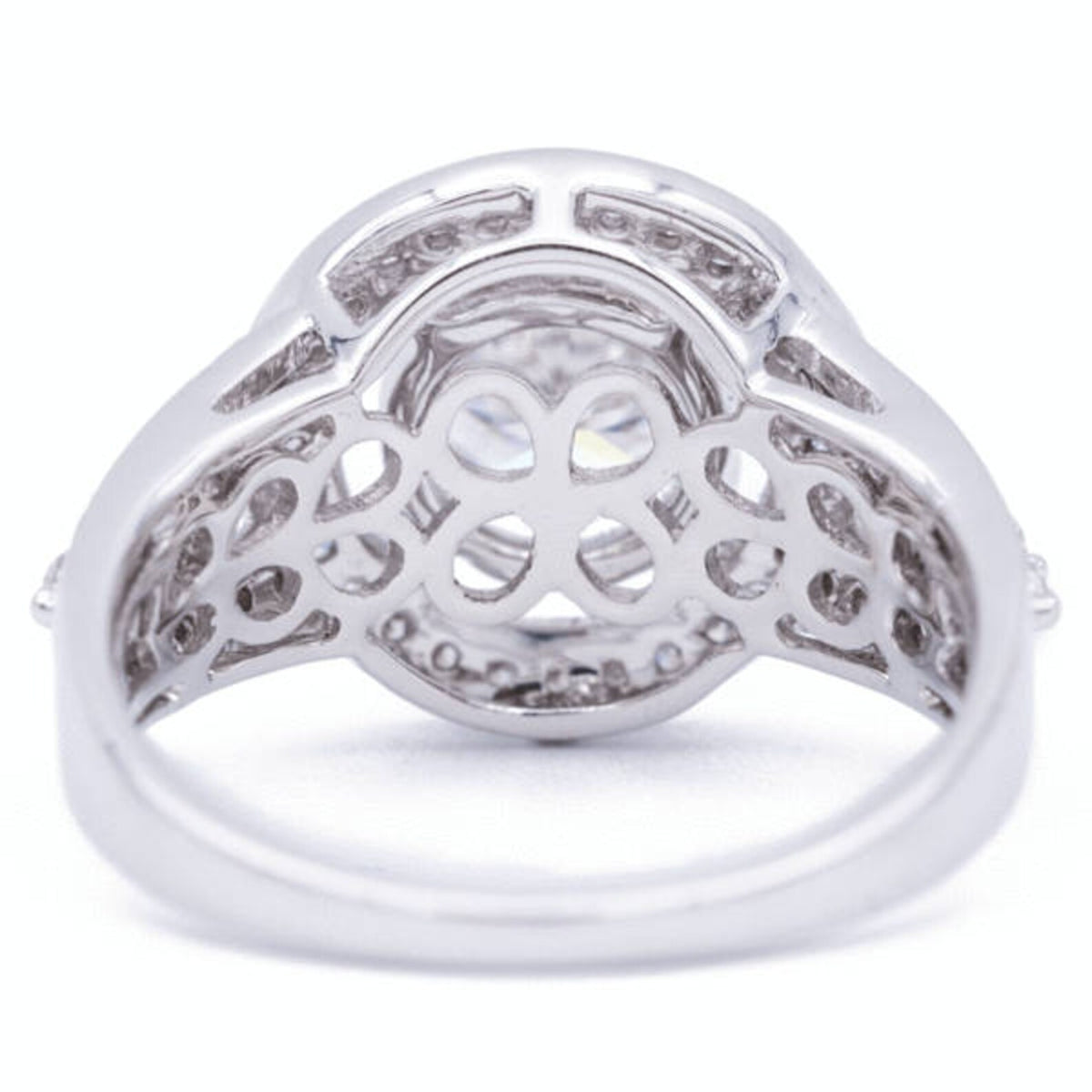 Underside view of lab grown diamond halo ring showing intricate floral filigree gallery and openwork band architecture