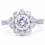 Top-down view of 3 carat round brilliant lab diamond in a flower bloom scalloped halo setting