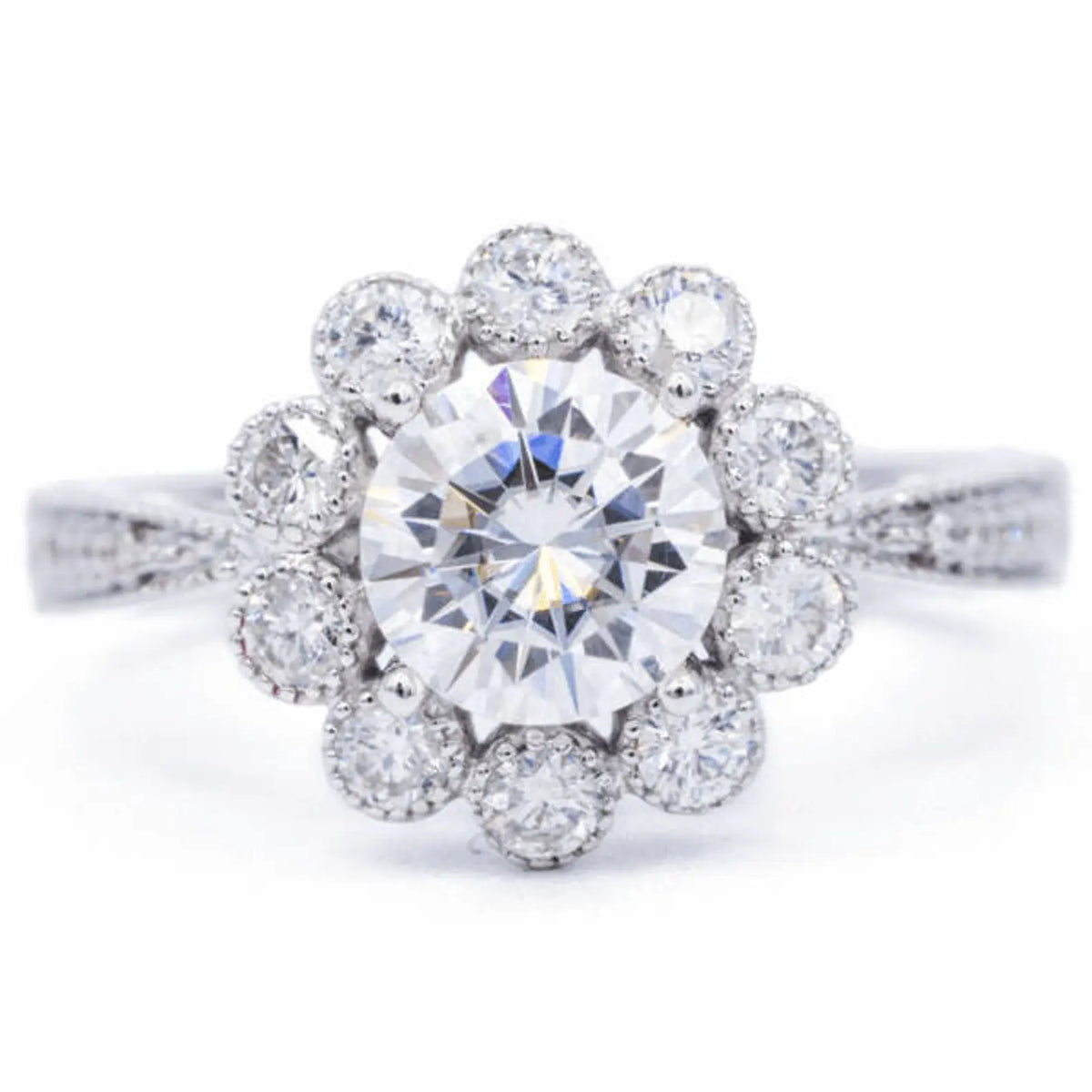 Top-down view of 3 carat round brilliant lab diamond in a flower bloom scalloped halo setting
