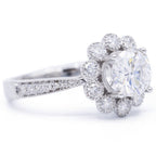 Perspective angle showing 3 CT round center diamond surrounded by scalloped diamond cluster halo