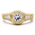 Front view of 2 CT round lab grown diamond ring in yellow gold with hand-engraved leaf shank and side accent diamonds