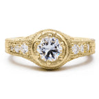 Front view of 2 CT round lab grown diamond ring in yellow gold with hand-engraved leaf shank and side accent diamonds