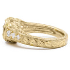 Side profile of yellow gold lab diamond vintage ring displaying detailed leaf scroll carving and milgrain edging