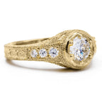 Perspective view of 2 carat round lab created diamond ring with vintage framed setting and accent stones