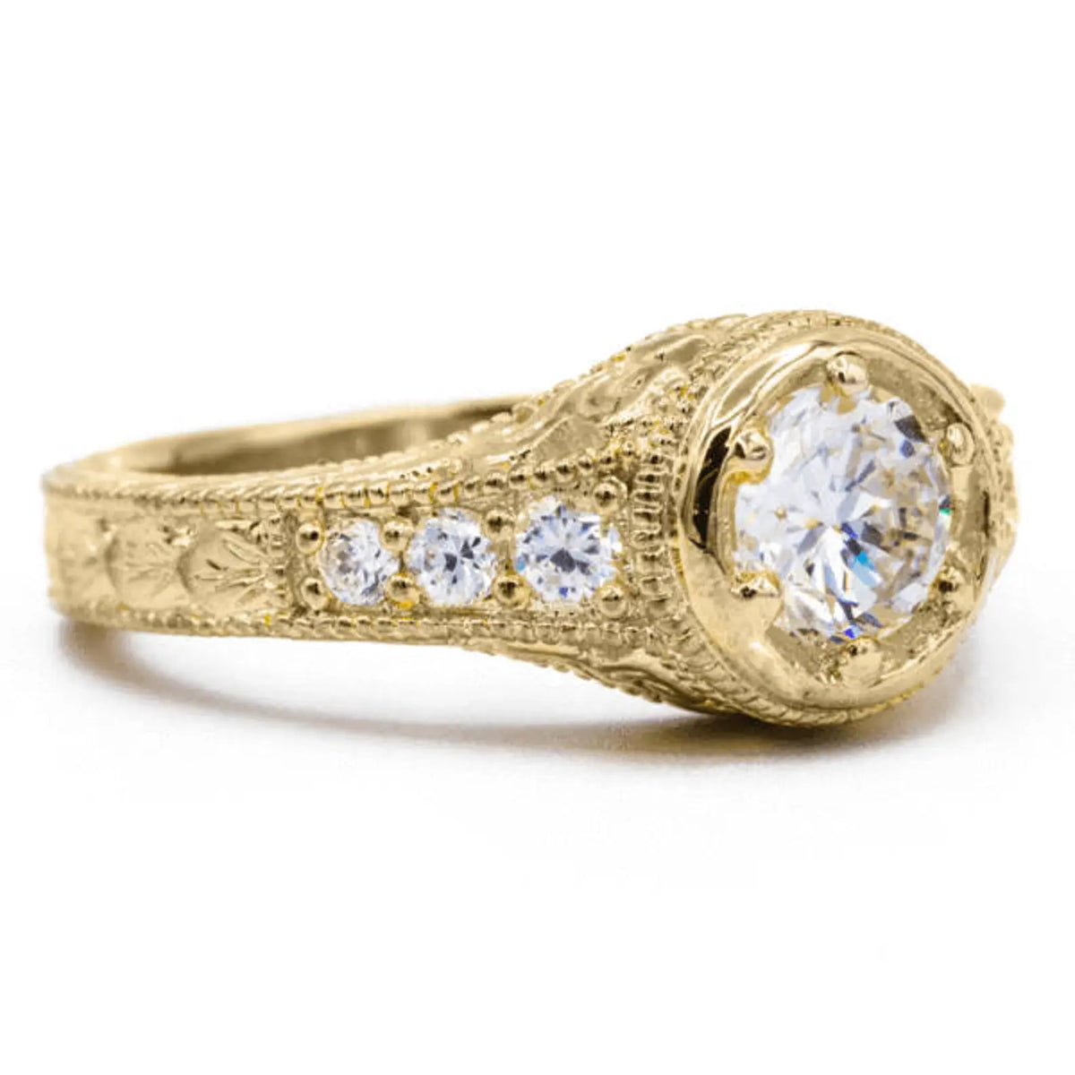 Perspective view of 2 carat round lab created diamond ring with vintage framed setting and accent stones