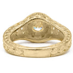 Underside view of yellow gold vintage diamond ring showing textured band structure and center stone setting