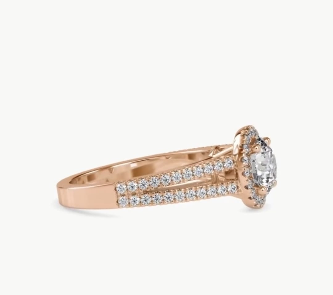 Side profile showing the halo setting and double pavé band of a round lab diamond rose gold ring.