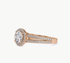 Profile view showcasing the round diamond center stone surrounded by a delicate pave halo.