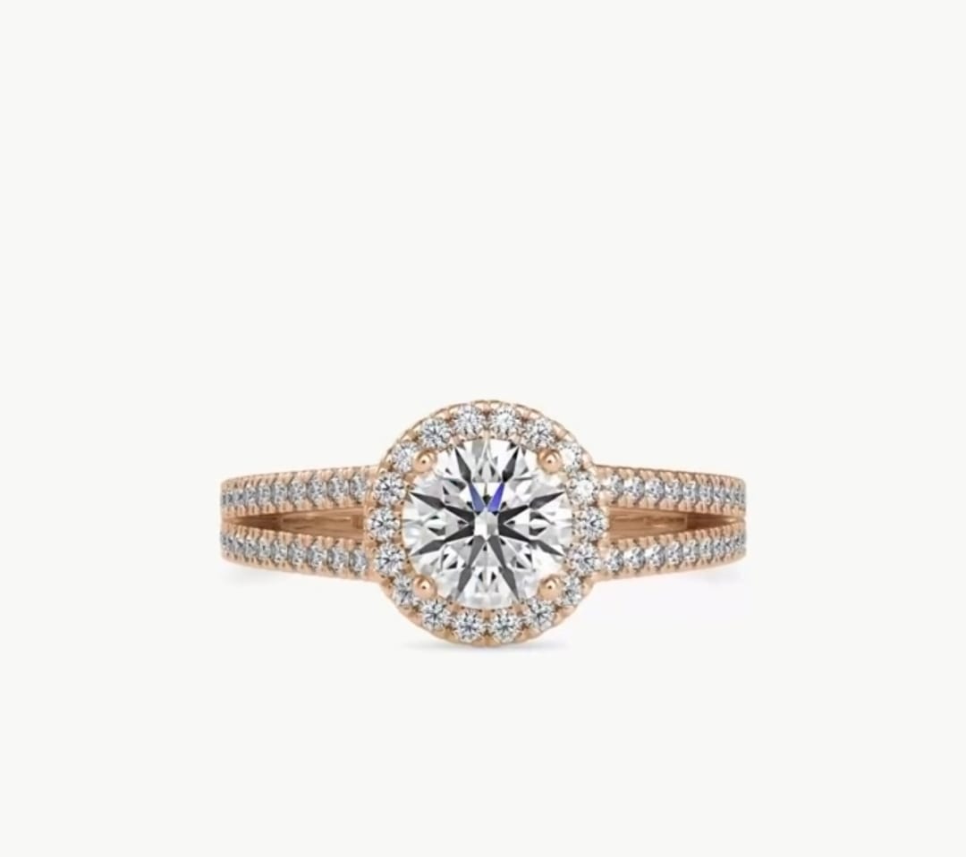 Direct top-down view of a 2 carat round cut lab grown diamond halo ring on a rose gold split-shank band.