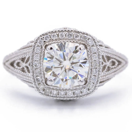 Top view of 2 CT cushion cut lab grown diamond ring with milgrain cushion halo and filigree shoulders