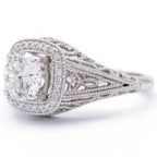Three-quarter perspective of lab diamond cushion halo ring displaying side lace openwork detailing