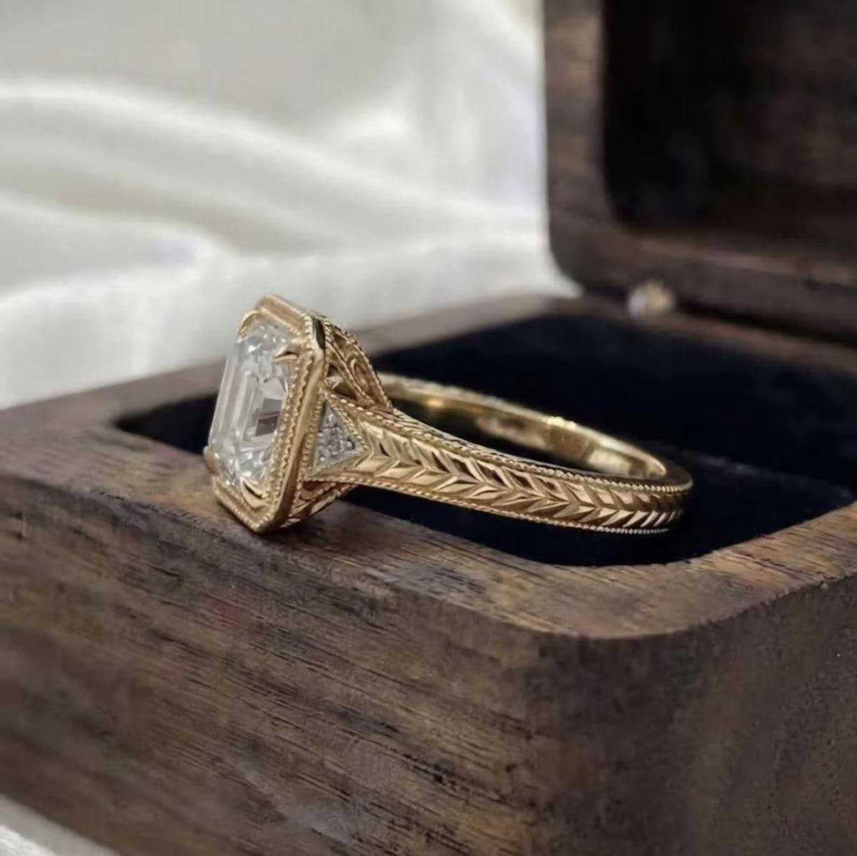 Side profile view of 3 CT Asscher cut lab grown diamond engagement ring with side triangle accents