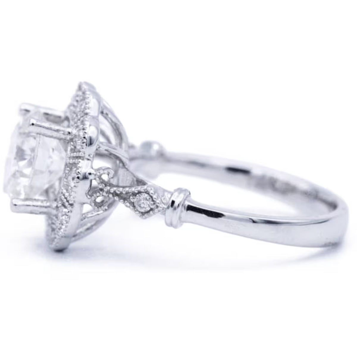 Front perspective view of 3 CT round lab diamond engagement ring with floral scalloped milgrain halo frame