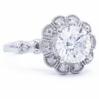 Side profile view of 3 CT round cut lab grown diamond vintage scalloped halo ring showing filigree cathedral gallery