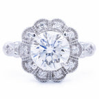 Direct top-down symmetry view of 3 CT round brilliant lab grown diamond inside floral scalloped halo bezel