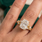 On-hand view of a 4 CT radiant cut lab grown diamond engagement ring in yellow gold showcasing finger coverage and scale.
