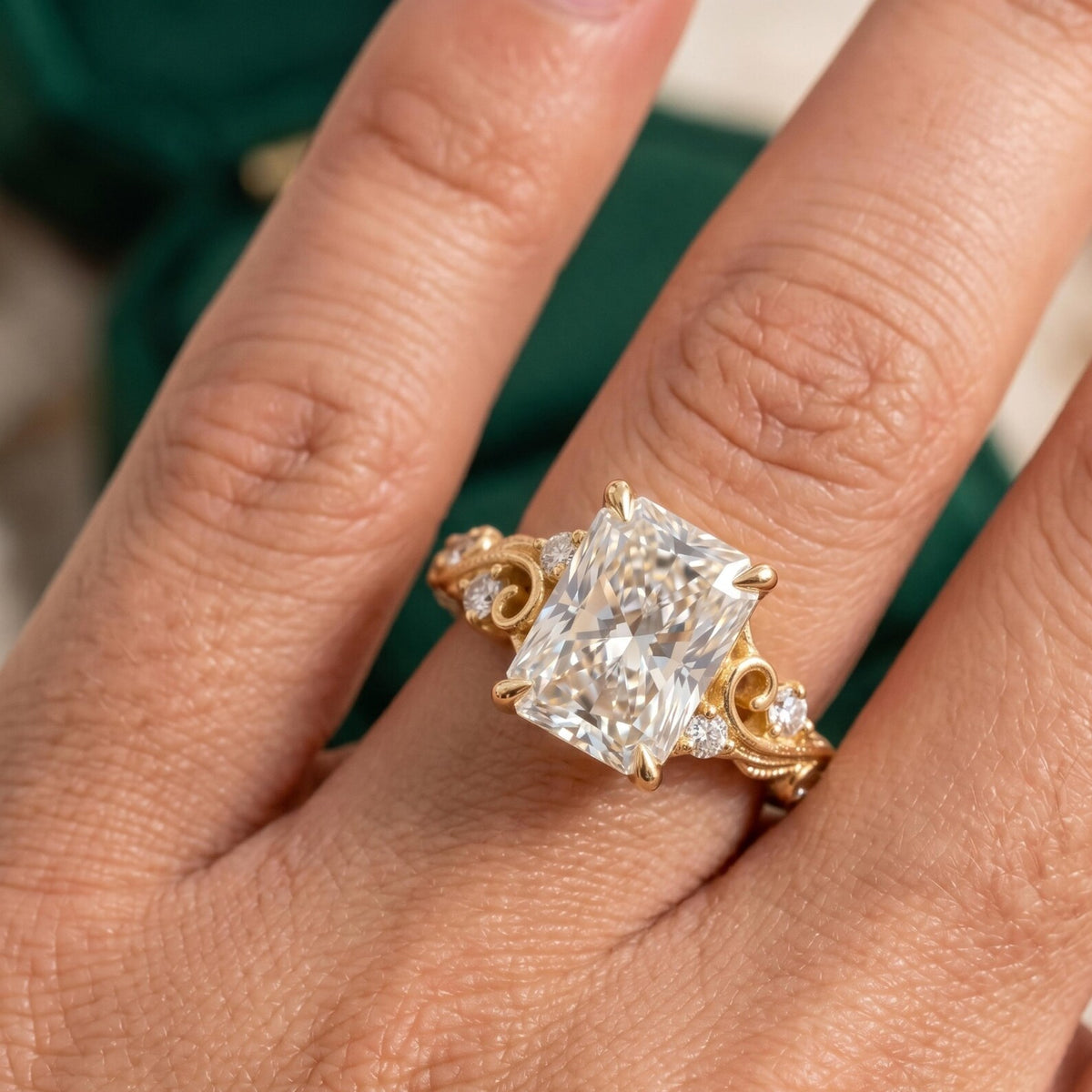 On-hand view of a 4 CT radiant cut lab grown diamond engagement ring in yellow gold showcasing finger coverage and scale.