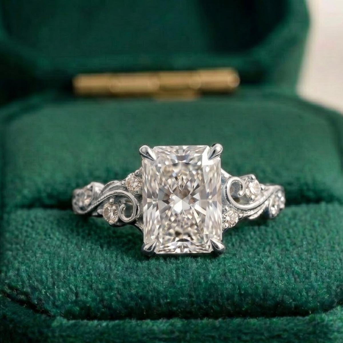 Frontal view of a white gold vintage filigree engagement ring with a 4 carat radiant cut lab-grown diamond centerpiece.