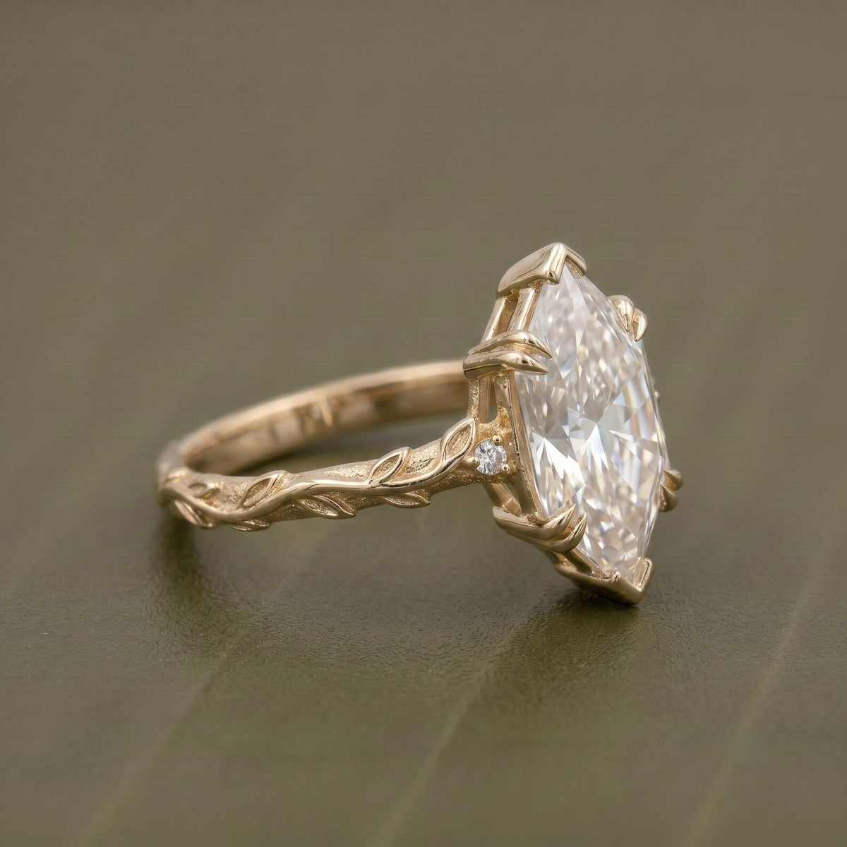 Alternate side angle of a yellow gold 4 CT Dutch marquise diamond engagement ring highlighting the shoulder diamond accent and leaf texture.