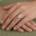 On-hand view of a 4 CT Dutch marquise cut lab grown diamond engagement ring with a nature-inspired yellow gold leaf band.