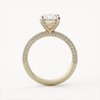Side profile view of a yellow gold oval lab diamond ring featuring a hidden halo collar and cathedral setting.