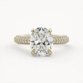 Front view of a 2 CT oval lab grown diamond engagement ring set in 14K yellow gold with a triple-row micro-pavé band.