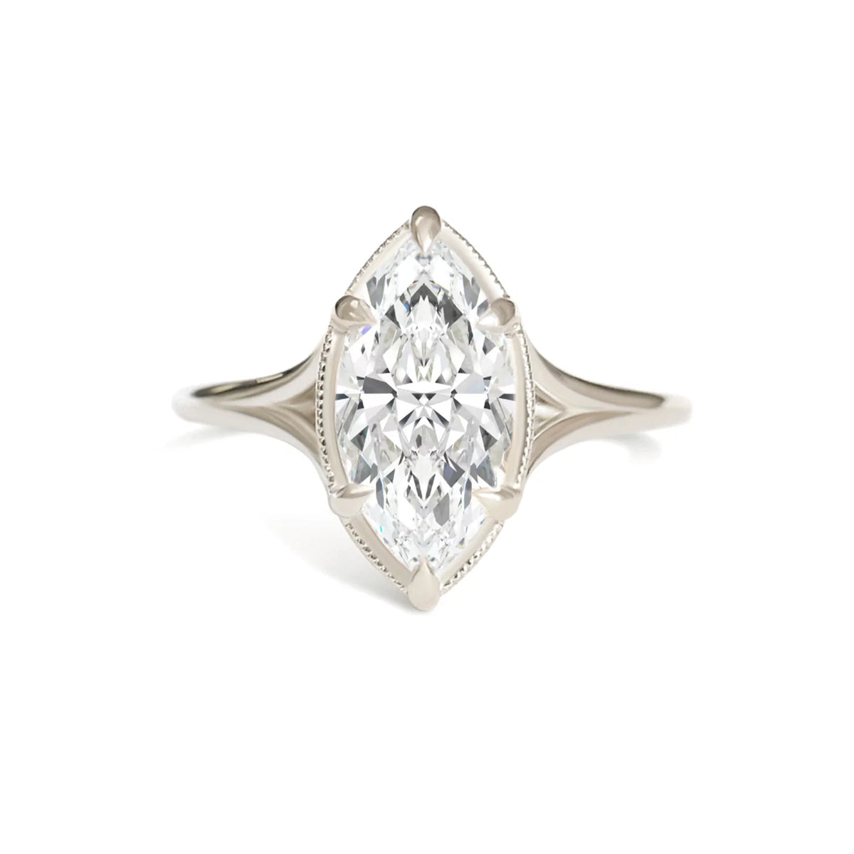 Profile view of a 3 carat marquise lab grown diamond solitaire ring on finger against a soft pink knit sweater.