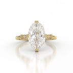 Studio front shot of 4 CT oval lab grown diamond engagement ring in yellow gold with vintage filigree accents.