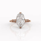 Front view of a 4 CT oval lab created diamond ring set in 14K rose gold with decorative textured prongs.